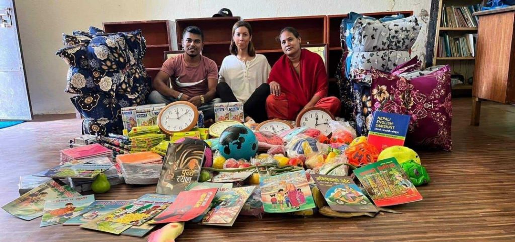 Volunteer Donating study, games and sports material to school